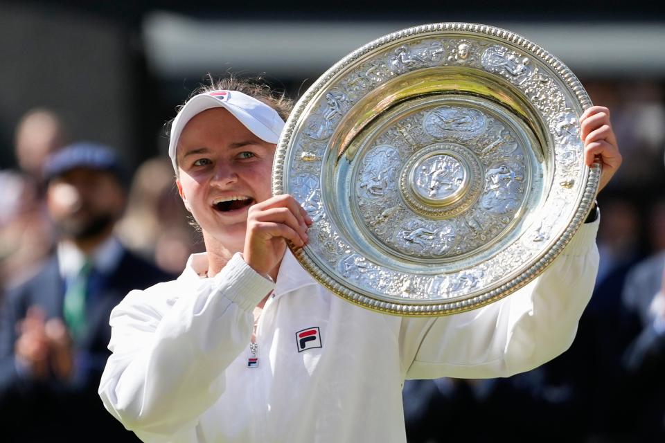 Barbora Krejcikova of the Czech Republic holds her trophy aloft (AP)