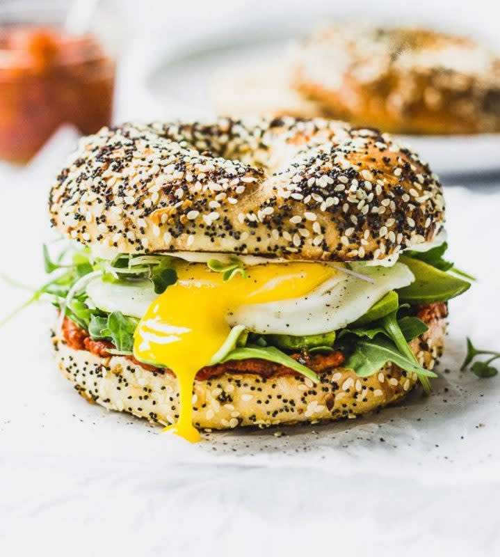 <p>ForkInTheKitchen.com</p><p>Romesco sauce, cream cheese, a perfectly fried egg and peppery arugula, all on top of a toasted everything bagel.</p><p><strong>Get the recipe: <a href="https://www.forkinthekitchen.com/romesco-breakfast-bagel-sandwich/" rel="nofollow noopener" target="_blank" data-ylk="slk:Romesco Breakfast Bagel Sandwich;elm:context_link;itc:0;sec:content-canvas" class="link ">Romesco Breakfast Bagel Sandwich</a></strong></p>