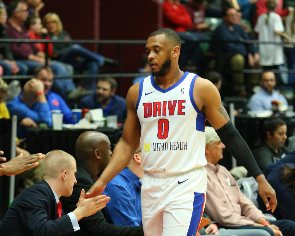 Zeke Upshaw of the Grand Rapids Drive high-fives coaches and teammates during a game on March 23, 2018. Upshaw collapsed on the court late in Saturday’s game against the Long Island Nets. He died in the hospital on Monday morning. He was 26. (Getty)