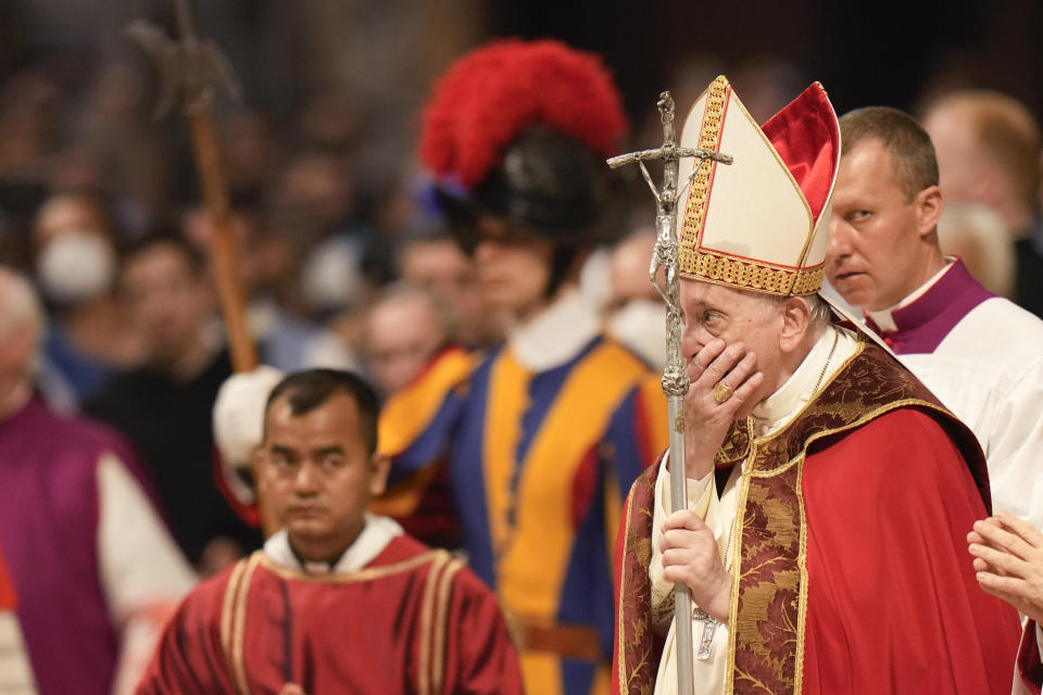 Pope Francis holds the crucifix as he celebrates a Mass on the Solemnity of Saints Peter and Paul, in St. Peter's Basilica at the Vatican, Wednesday, June 29, 2022. (AP Photo/Alessandra Tarantino)