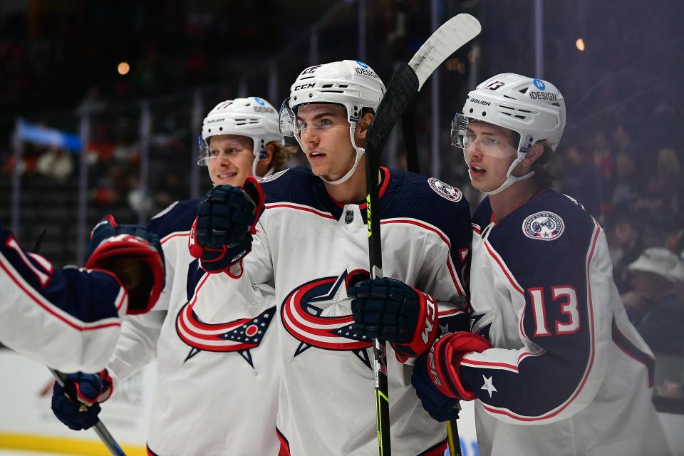 Apr 17, 2022; Anaheim, California, USA; Columbus Blue Jackets defenseman Jake Bean (22) celebrates his goal scored against the Anaheim Ducks during the first period at Honda Center. Mandatory Credit: Gary A. Vasquez-USA TODAY Sports