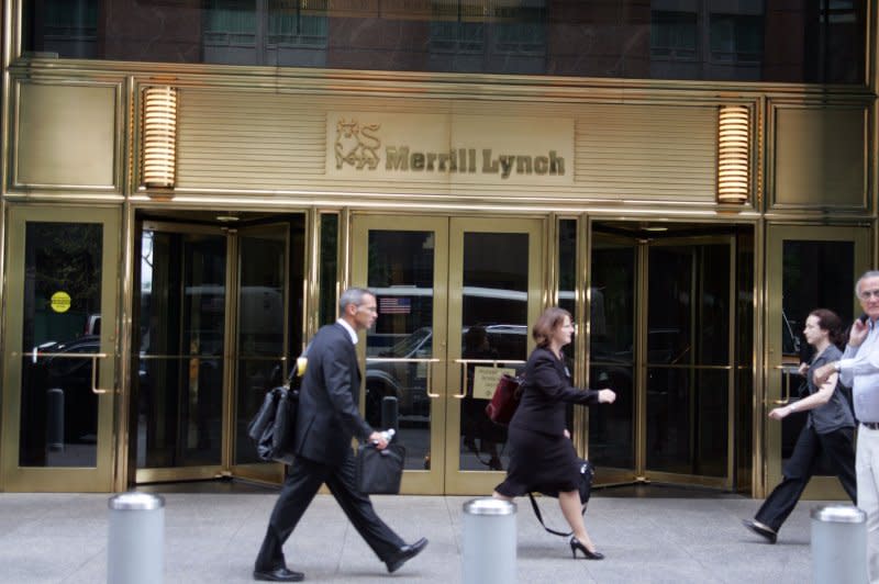 People walk passed the Merrill Lynch building at 4 World Trade Center in New York on September 15, 2008. Bank of America agreed to buy Merrill Lynch for about $44 billion in a mega-deal on September 14, 2008. File Photo by Laura Cavanaugh/UPI