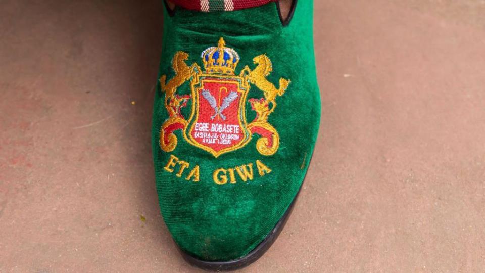 A general view of a customised shoe worn by members of the Egbe Bobasete during the annual Ojude Oba festival in Ijebu Ode on June 18, 2024. Ojude Oba festival is an ancient festival celebrated by the Yoruba people of Ijebu Ode, a town in Ogun State Nigeria. This annual festival usually takes place the third day after Eid El Kabir to pay homage and show respect to the King the Awujale of Ijebuland. (Photo by TOYIN ADEDOKUN / AFP) 