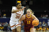 Iowa State guard Hannah Belanger (13) drives under pressure from Texas forward Madison Booker (35) during the first half of an NCAA college basketball game for the Big 12 tournament championship Tuesday, March 12, 2024, in Kansas City, Mo. (AP Photo/Charlie Riedel)