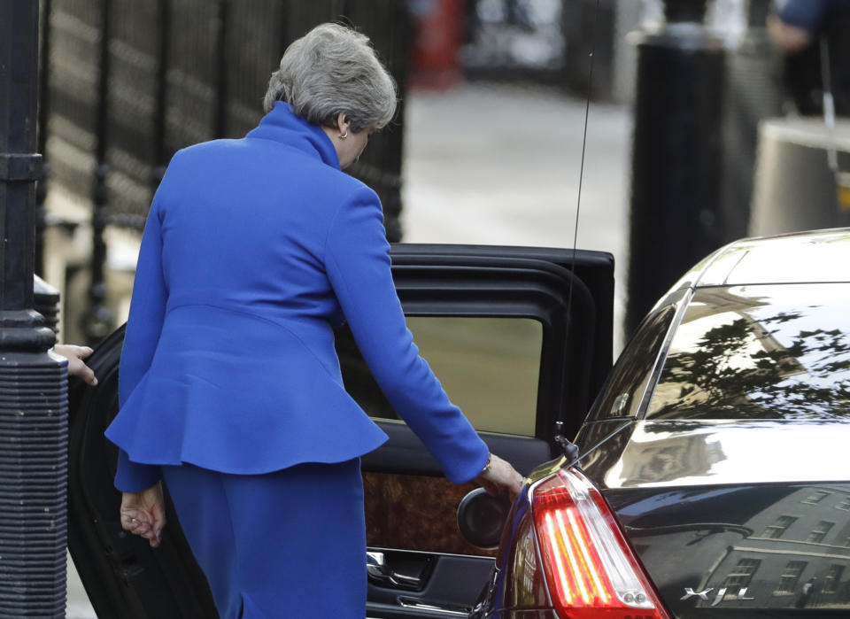 Britain's Prime Minister Theresa May leaves 10 Downing Street, London for Buckingham Palace, Wednesday, July 24, 2019. Boris Johnson will replace May as Prime Minister later Wednesday, following her resignation last month after Parliament repeatedly rejected the Brexit withdrawal agreement she struck with the European Union. (AP Photo/Matt Dunham)