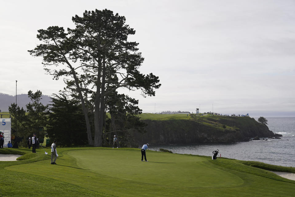 Joseph Bramlett makes a birdie putt on the fifth green of the Pebble Beach Golf Links during the third round of the AT&T Pebble Beach Pro-Am golf tournament in Pebble Beach, Calif., Saturday, Feb. 4, 2023. (AP Photo/Eric Risberg)