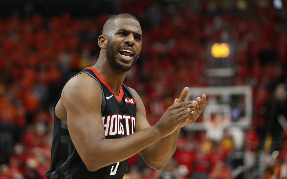 Houston Rockets guard Chris Paul (3) celebrates with his bench in the second half during an NBA basketball game against the Utah Jazz Saturday, April 20, 2019, in Salt Lake City. (AP Photo/Rick Bowmer)