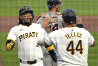 Pittsburgh Pirates' Connor Joe, left, and Rowdy Tellez (44) celebrate after scoring on a single by Joey Bart off Detroit Tigers starting pitcher Reese Olson during the second inning of a baseball game in Pittsburgh, Monday, April 8, 2024. (AP Photo/Gene J. Puskar)