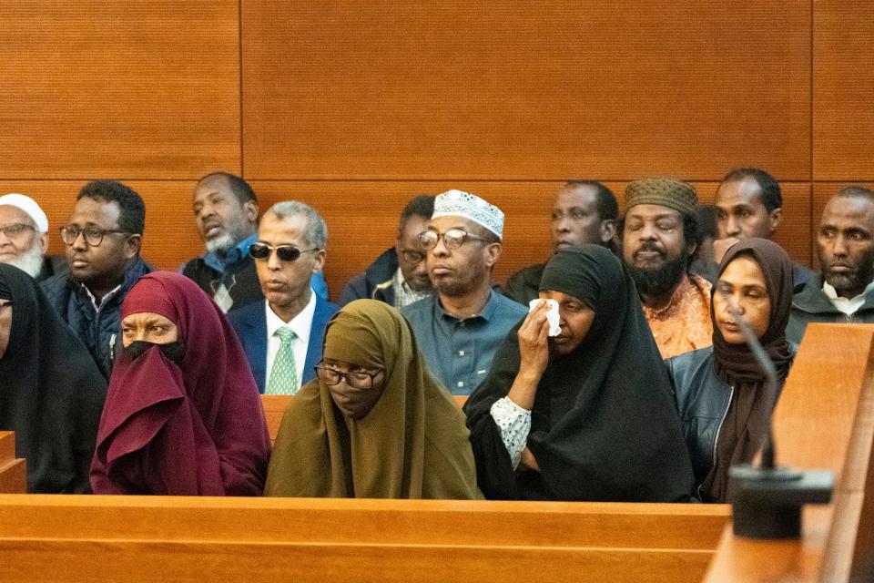 Members of the community cry during victim impact statements from the children of Imam Mohamed Hassan Adam during the sentencing Thursday, March 7, 2024, of his convicted killer, John Wooden Jr., 48, of Columbus. Wooden was sentenced to life in prison without the chance for parole for at least 73 years.