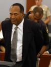 <p>O.J. Simpson is taken into custody after being found guilty on all 12 charges, including felony kidnapping, armed robbery and conspiracy at the Clark County Regional Justice Center in Las Vegas on Friday, Oct. 3, 2008. The verdict comes thirteen years to the day after he was acquitted of double murder charges. (Photo: Daniel Gluskoter, Pool/AP) </p>