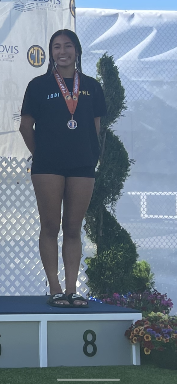 Savanna Berry of Lodi swimming and diving poses with her medal after the CIF State Swimming and Diving Meet on May 11 at Clovis West High School.