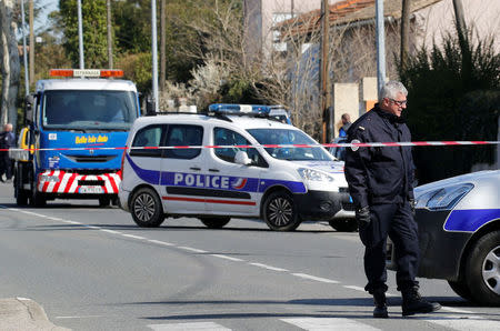 French police officers secure the area during a security operation in Carcassonne, near the supermarket of Trebes, France, March 23, 2018. REUTERS/Regis Duvignau