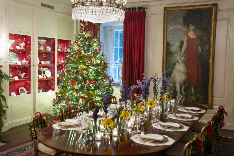 FILE - The China Room of the White House is decorated for the holiday season during a press preview of the White House holiday decorations Nov. 29, 2021, in Washington. In addition to fewer people passing through the White House for the open houses, thousands of other people didn't get a close-up look at how Jill Biden decked out White House hallways and public rooms for the holidays because public tours of the executive mansion remain on indefinite hold due to COVID-19. (AP Photo/Evan Vucci, File)