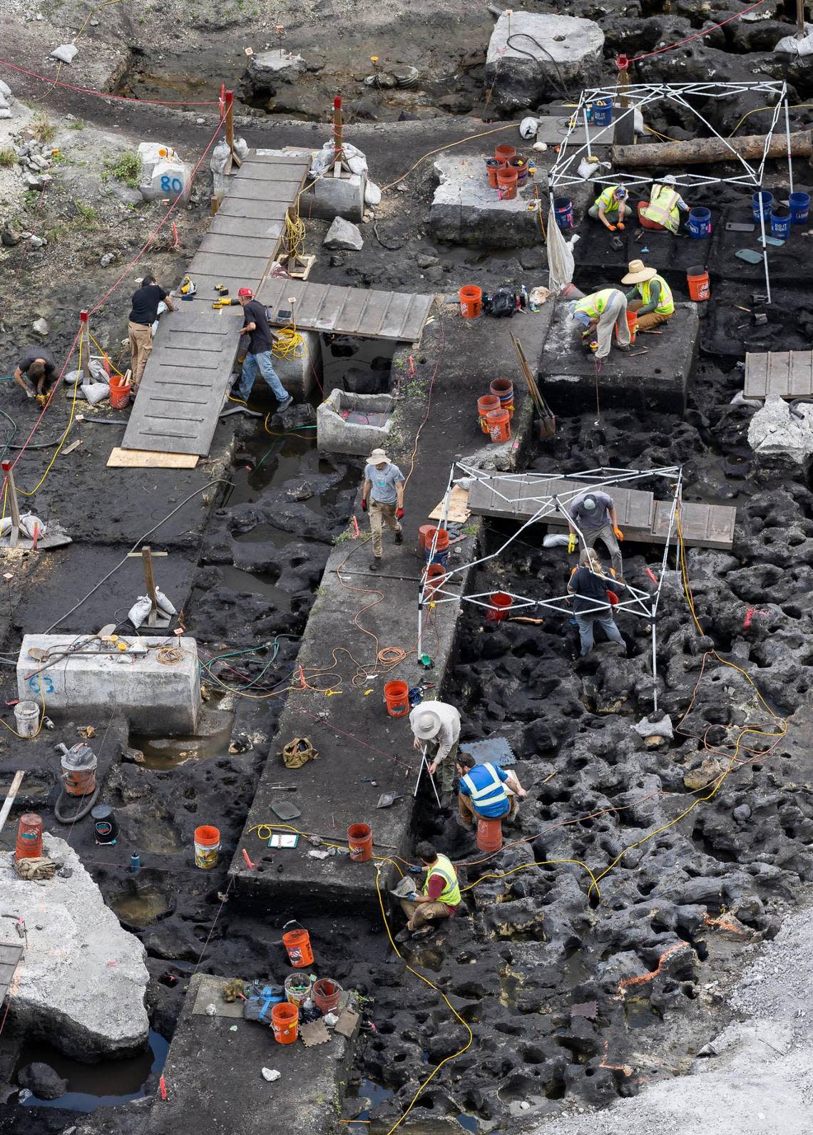 Members of an archaeological team work at the site of a planned Related Group residential tower complex in Brickell at the mouth of Miami River. The team has unearthed extensive evidence of prehistoric indigenous settlement on the site and artifacts dating back to the dawn of human civilization 7,000 years ago.