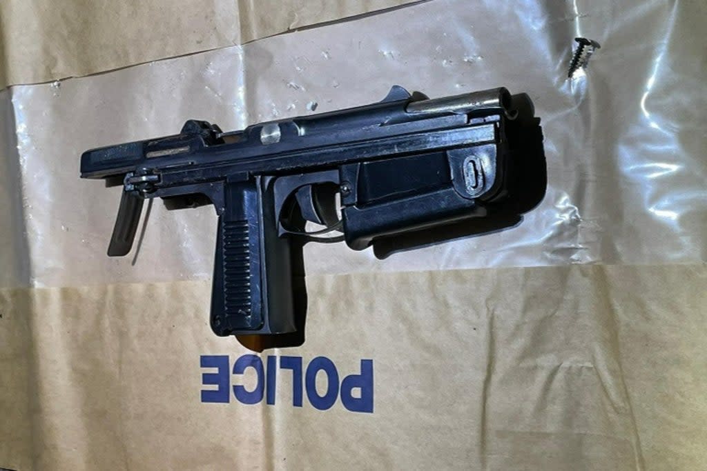 Two men have been arrested after a PM63 RAK machine pistol (pictured) was found in a car  (Met Police)