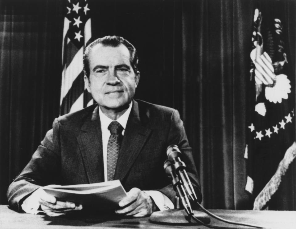 President Nixon poses Sunday night Aug. 15, 1971 in his White House office after delivering a nationwide television address loaded with economic news. (AP Photo/HWG)