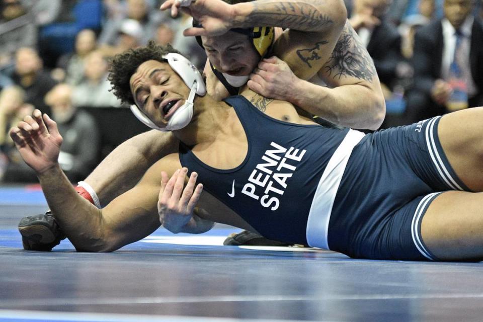 Penn State’s Greg Kerkvliet attempts to escape from Michigan’s Mason Parris in their 285-pound finals match of the NCAA Championships on Saturday, March 18, 2023 at the BOK Center in Tulsa, Okla. Parris defeated Kerkvliet, 5-1, to earn his first title.