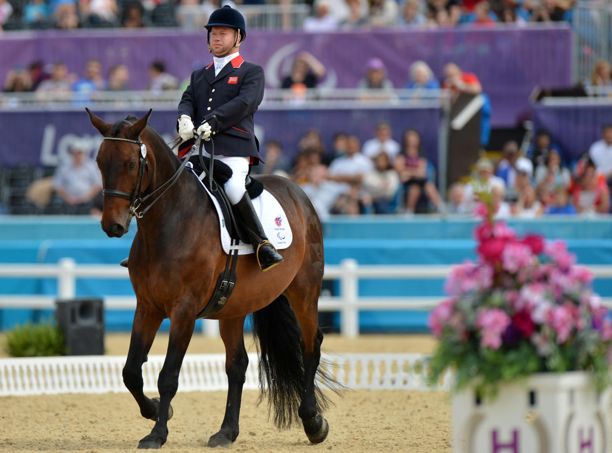 Britain's Lee Pearson competes on his horse Gentleman during the Dressage Individual - Grade 1b final at the London 2012 Paralympic Games in Greenwich Park in London, on September 1, 2012. AFP PHOTO / BEN STANSALL        (Photo credit should read BEN STANSALL/AFP/GettyImages)