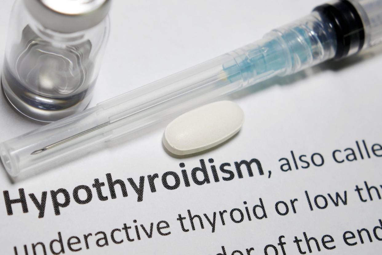 hypothyroidism printed definition with needle and pill