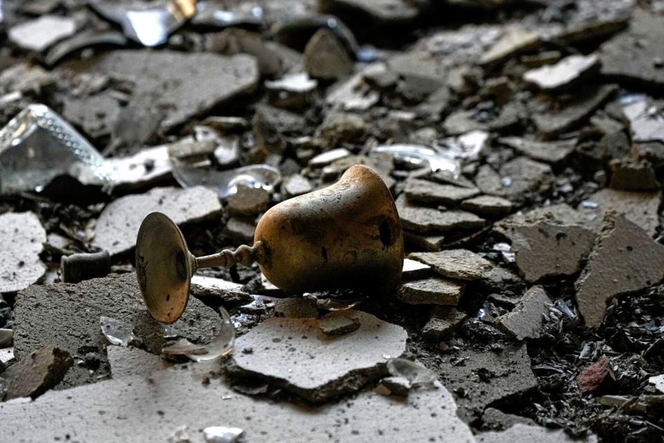 A burnt Kiddush cup in a house damaged by Hamas militants is seen in Kibbutz Be'eri, Israel,