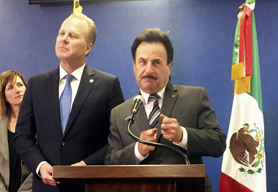 San Diego Mayor Kevin Faulconer, left, and Tijuana, Mexico, Mayor Juan Manuel Gastelum discuss the benefits of cross-border ties at a news conference at San Diego City Hall, Monday, Feb. 6, 2017. The mayors of the largest metropolitan area on the U.S.-Mexico border called for stronger binational ties, striking a sharp contrast with U.S. President Donald Trump's calls to build a wall and renegotiate the North American Free Trade Agreement. (AP Photo/Elliot Spagat)