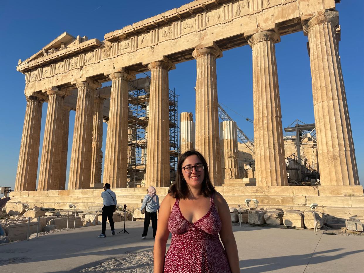 hannah standing in front of the parthenon in athens greece