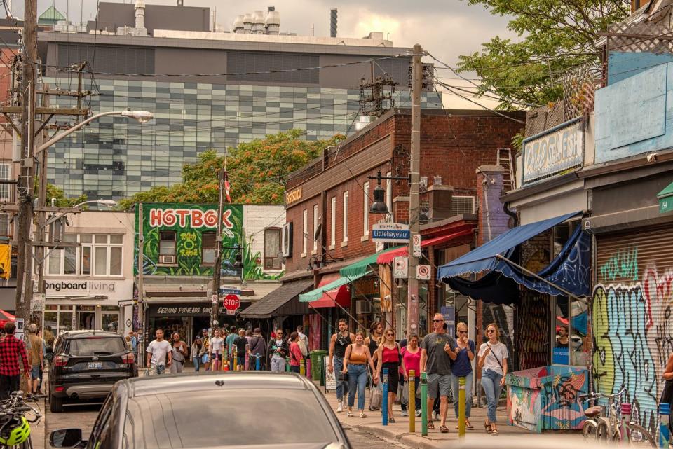 a street in kensington market in toronto