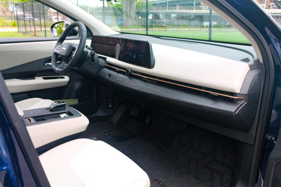 The interior of the Nissan Ariya, as viewed from the passenger door.