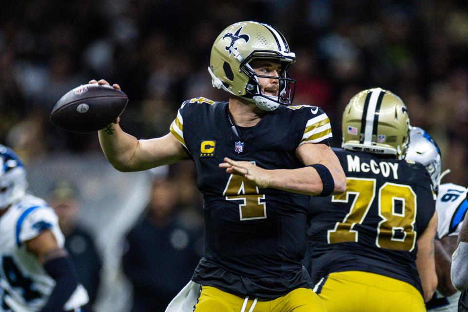 Week 14: New Orleans Saints quarterback Derek Carr (4) passes against the Carolina Panthers at the Superdome. The Saints wore throwback jerseys in the 28-6 win.