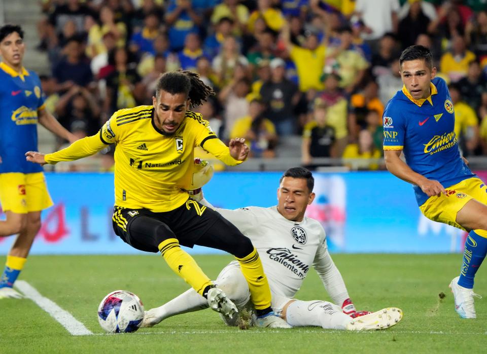 Jul 31, 2023; Columbus, OH, USA; Club America goalkeeper Luis Malagon (1) takes down Columbus Crew defender Mohamed Farsi (23) that resulted in a penalty kick for the Crew during the second half of the League Cup group match at Lower.com Field. 