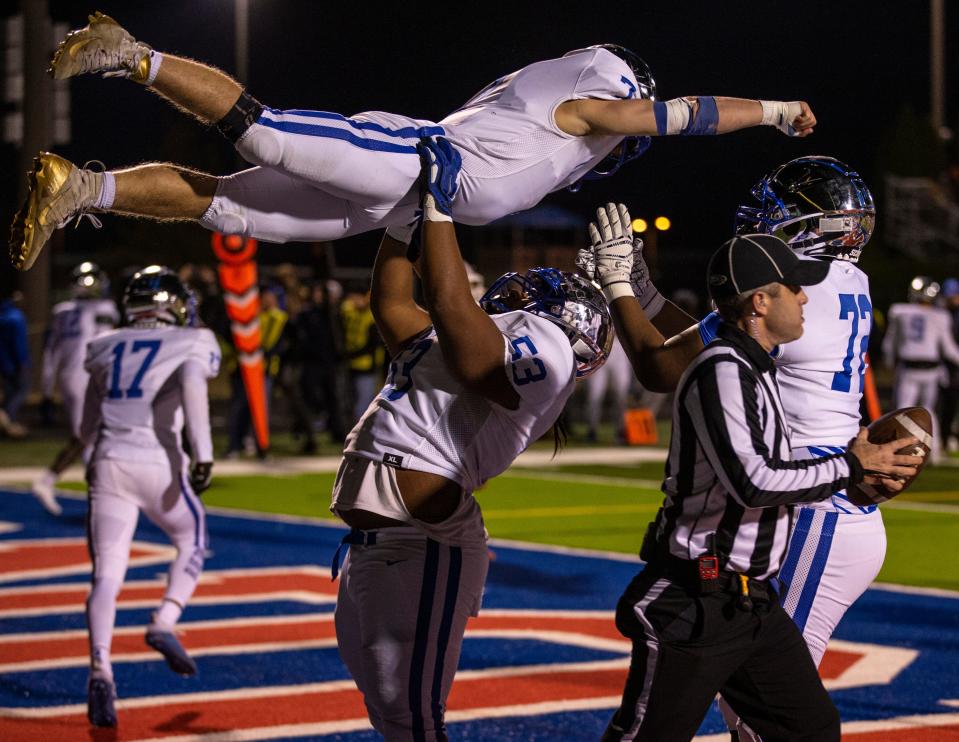 Paducah Tilghman's Malachi Rider is raised in the air by a teammate after scoring a touchdown against Christian Academy of Louisville. Nov 19, 2021