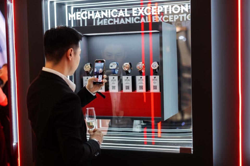 A guest admiring the watches on display at Grand Prix d’Horlogerie de Genève exhibition. — Picture courtesy of The Hour Glass