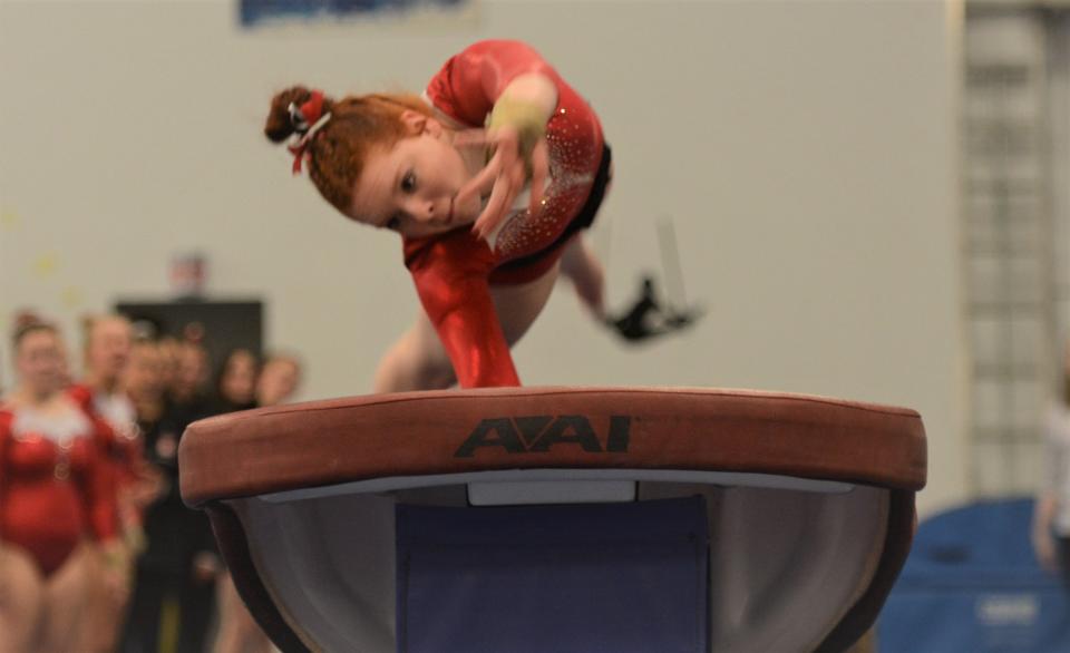 NFA senior co-captain Sarah Fedeli competes on the vault at Thames Valley Academy in Franklin.