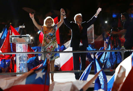 Presidential candidate Sebastian Pinera and his wife Cecilia Morel wave to supporters after winning Chile's presidential election in Santiago, Chile, December 17, 2017. REUTERS/Carlos Vera