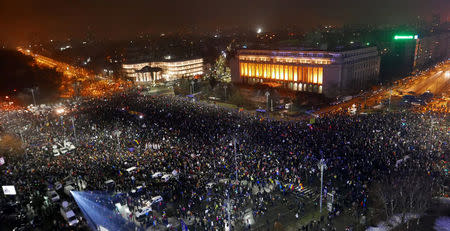 Protesters gather in front of the government building during a protest in Victoriei Square, in Bucharest, Romania, February 5, 2017. REUTERS/Alex Fraser TPX IMAGES OF THE DAY