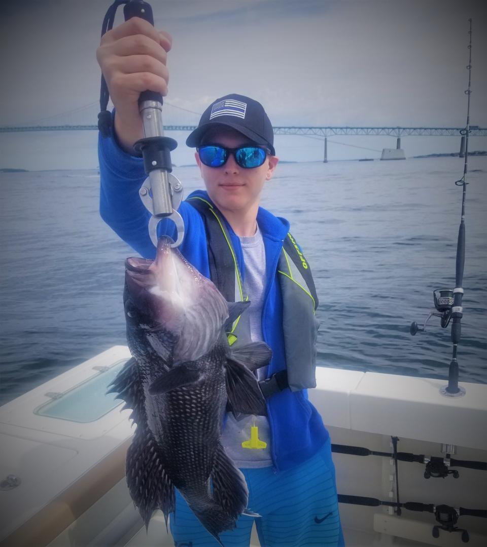 Reicher caught a 19-inch black sea bass at the Newport Bridge fishing with his grandfather, Ed Jacques, and his great-uncle, Richard Jacques, of North Kingstown.