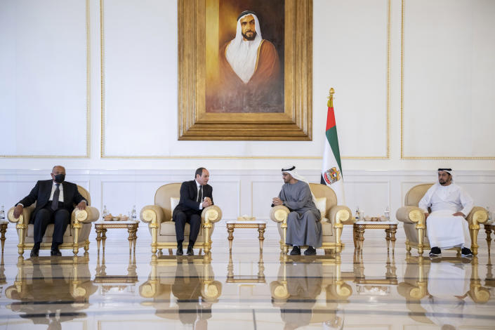 This photo provided by the Ministry of Presidential Affairs, shows Egyptian President Abdel Fattah El Sisi, centr left, speaking with Sheikh Mohamed bin Zayed Al Nahyan, President of the UAE and Ruler of Abu Dhabi, as he offers his offers condolences on the death of Sheikh Khalifa bin Zayed Al Nahyan, the late President of the United Arab Emirates, at the Presidential Airport in Abu Dhabi, UAE, Saturday May 14, 2022. (Mohamed Al Hammadi/Ministry of Presidential Affairs via AP)