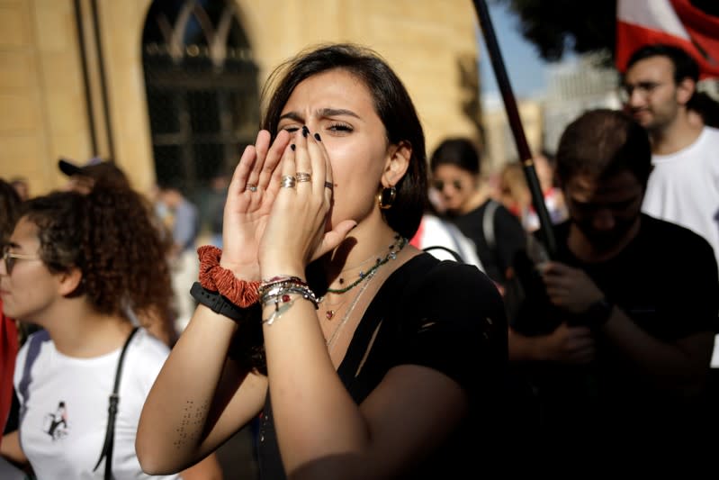 A protester shouts slogans at a demonstration organised by students during ongoing anti-government protests in Beirut