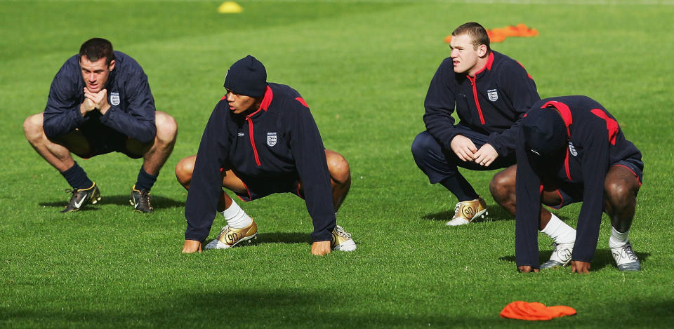 MANCHESTER, ENGLAND - OCTOBER 8: (2nd R-L) Wayne Rooney of England warms up along side Jamie Carragher and Jermaine Jenas during Training ahead of the Wold Cup Qualifying match between England and Wales at Old Trafford on October 8, 2004 in Manchester, England. (Photo by Laurence Griffiths/Getty Images)