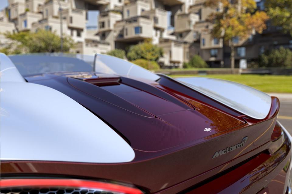 <p>Built to celebrate McLaren's Canadian Can-Am history, the 570S Canada commission sports red-tinted carbon fiber panels paired with white fenders, along with a few other touches. </p>