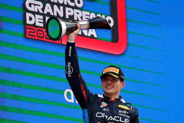 Max Verstappen holds the trophy aloft 