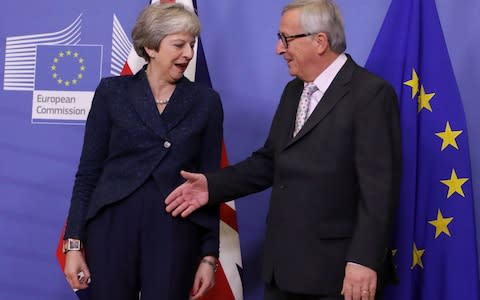 Jean-Claude Juncker greets Theresa May in Brussels - Credit: &nbsp;Olivier Matthys