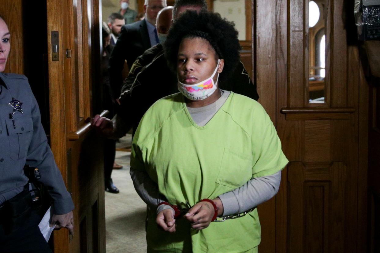 Jaelynn Billups is escorted out of Tippecanoe County Superior Court 2 after being sentenced to 51 years in prison, Friday, Dec. 3, 2021 in Lafayette. Billups was found guilty in October of felony murder, two counts of murder while committing a felony, conspiracy to commit armed robbery, armed robbery, theft, pointing a firearm, carrying a handgun without a license and theft of a firearm.