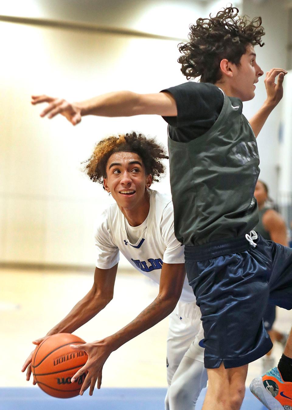 Bulldog forward Jalik Fernandes looks to sneak a pass by an Excel defender under the Holbrook basket.

The Holbrook Bulldogs hosted Excel Academy in boys basketball on Tuesday Dec. 19, 2023