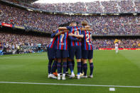 Barcelona players celebrate after Ansu Fati scored the opening goal during a Spanish La Liga soccer match between Barcelona and Mallorca at the Camp Nou stadium in Barcelona, Spain, Sunday, May 28, 2023. (AP Photo/Joan Monfort)