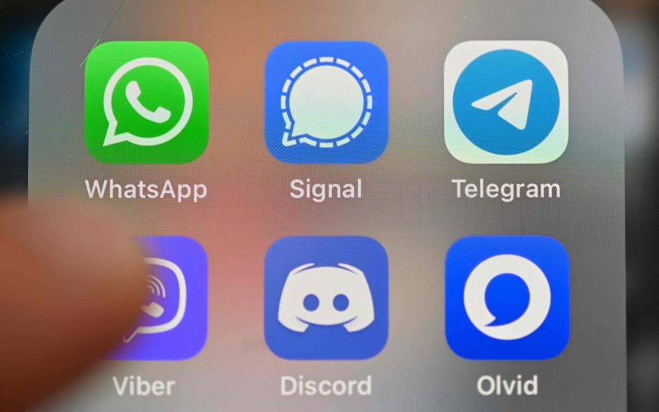 The logos of WhatsApp, Signal and Telegram on a smartphone screen