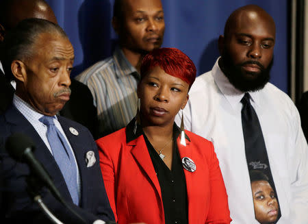 FILE PHOTO: (L-R) U.S. civil rights leader Reverend Al Sharpton appears with the parents of Michael Brown, Lesley McSpadden and Michael Brown Sr., at a news conference at the National Press Club in Washington, DC, U.S., September 25, 2014. REUTERS/Gary Cameron/File Photo