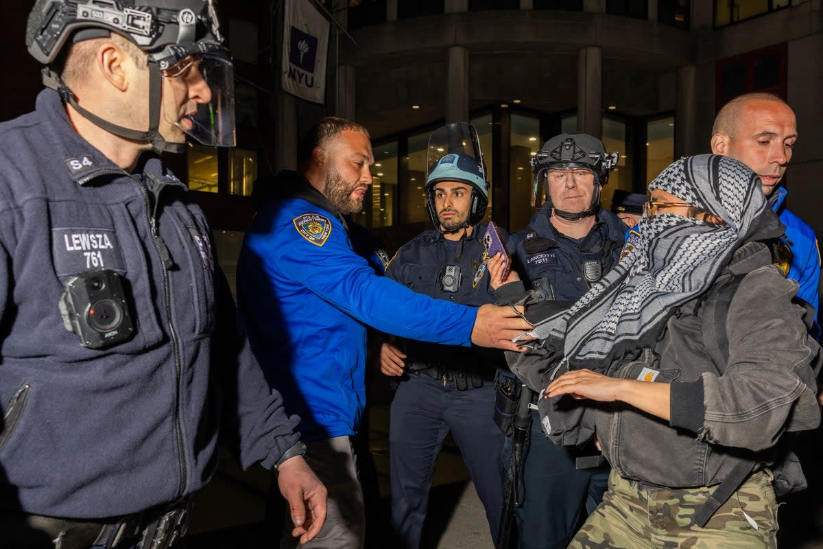 Police detain pro-Palestine protesters who had set up an encampment on the campus of New York University (AFP via Getty Images)