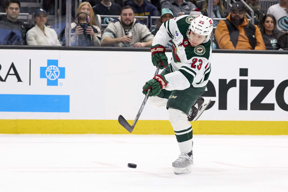 Minnesota Wild center Marco Rossi shoots against the Seattle Kraken goal but has it blocked during the second period of an NHL hockey game, Sunday, Dec. 10, 2023, in Seattle. (AP Photo/John Froschauer)