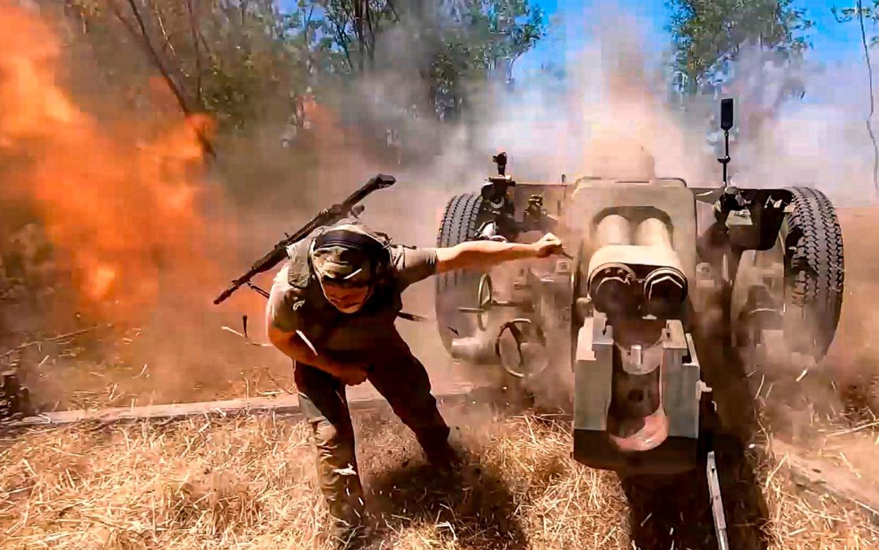 A Russian soldier fires from D-30 howitzer